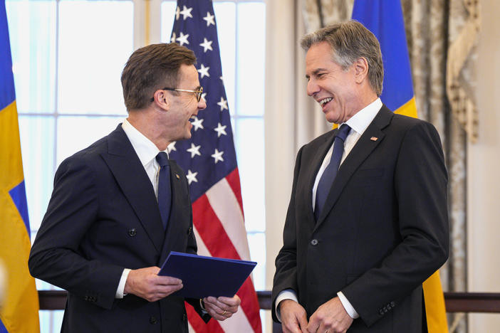 U.S. Secretary of State Antony Blinken (right) stands with Swedish Prime Minister Ulf Kristersson before presenting Sweden's NATO Instruments of Accession in the Benjamin Franklin Room at the State Department on Thursday in Washington
