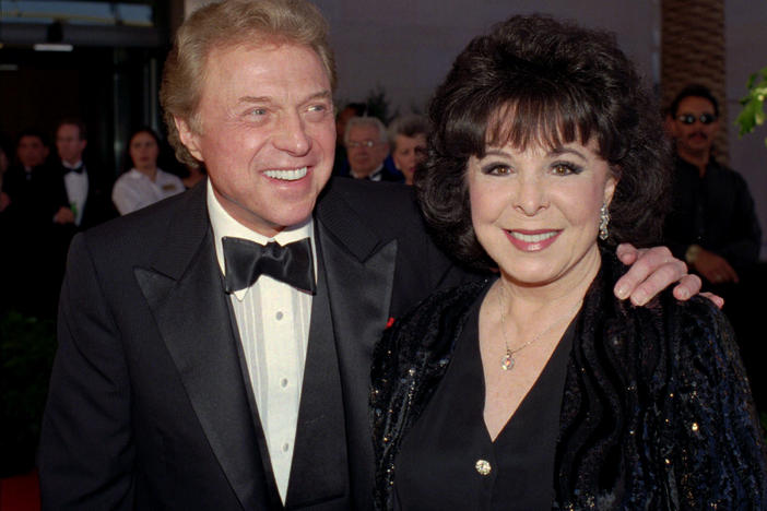 Singer Steve Lawrence (left) and his wife Eydie Gorme arrive at a black-tie gala honoring Frank Sinatra in Las Vegas on May 30, 1998. Lawrence died Wednesday at age 88.