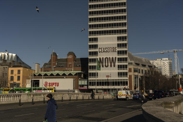 A large sign calling for a cease-fire in Gaza hangs from a building in Dublin on Feb. 12.