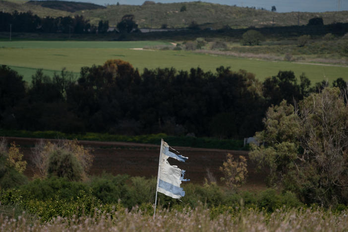 A tattered Israeli flag waves on Israel's southern border with the Gaza Strip on Thursday.