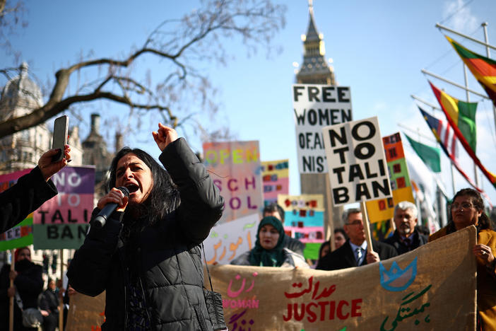Protesters hold signs at a demonstration calling for women's rights in Afghanistan in London's Parliament Square on International Women's Day on Friday.