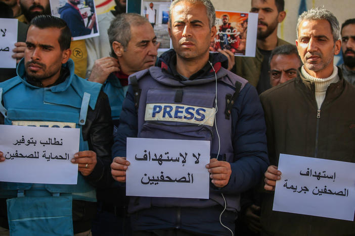 Palestinian journalists stage a protest to draw attention to Palestinian members of the media killed while covering the war in the Gaza Strip on Jan. 15, in Rafah, Gaza.