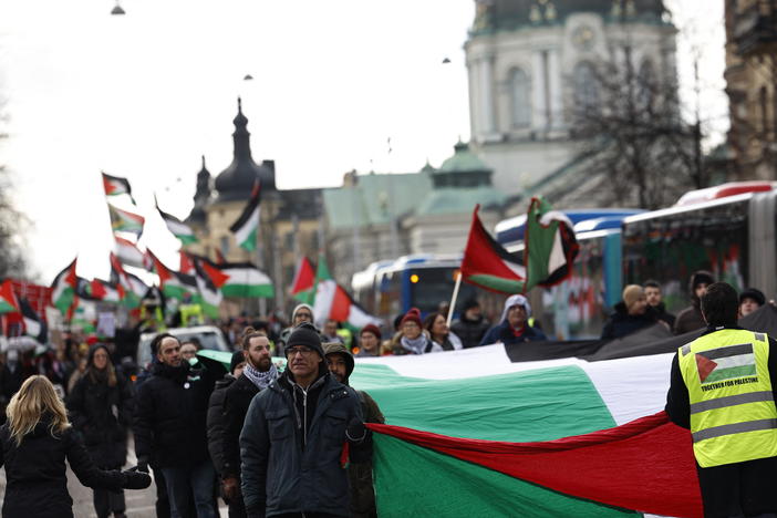 Pro-Palestinian supporters wave flags and carry placards during a march in central Stockholm last month in which demonstrators demanded Israel be excluded from the Eurovision Song Contest.