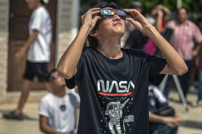 A man watches the annular solar eclipse in Merida, Mexico, last  October.