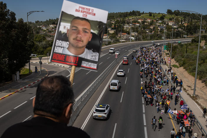Demonstrators near Beit Shemesh, Israel, carry stretchers representing each of the 134 Israelis still being held by Hamas on March 1. Amid fraught negotiations over conditions for a cease-fire, the families of the hostages held a four-day march from areas attacked on Oct. 7 in southern Israel to Jerusalem.
