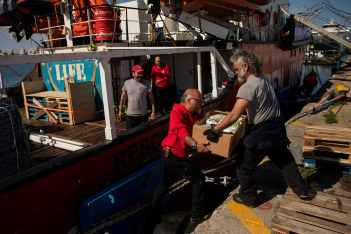 Open Arms members carry humanitarian aid for Gaza in a joint mission between NGOs Open Arms and World Central Kitchen at a port of Larnaca, Cyprus, March 9.
