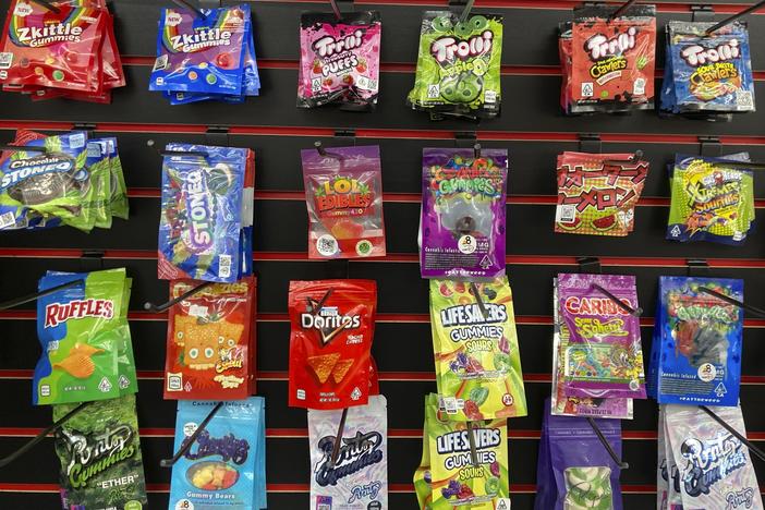 Edible products advertised as containing delta-8 THC offered for sale at a smoke shop in Seattle in 2022. Teens can overdo it with products like these, health officials warn.
