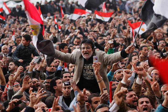 An anti-government protester is carried on shoulders in Tahrir Square in the afternoon before a speech by Egyptian President Hosni Mubarak in Tahrir Square February 10, 2011 in Cairo, Egypt.