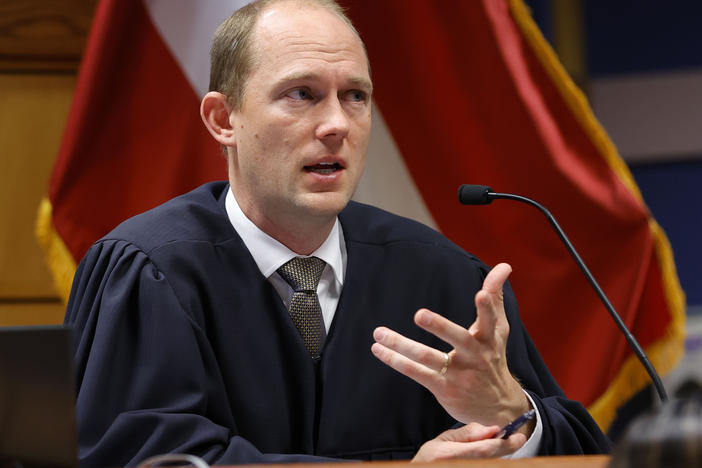 Fulton County Superior Judge Scott McAfee presides in court during a hearing in the Georgia election interference case.