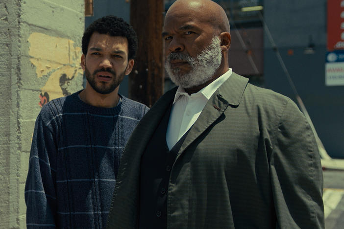 Aren (Justice Smith) and Roger (David Alan Grier) in <em>The American Society of Magical Negroes.</em>
