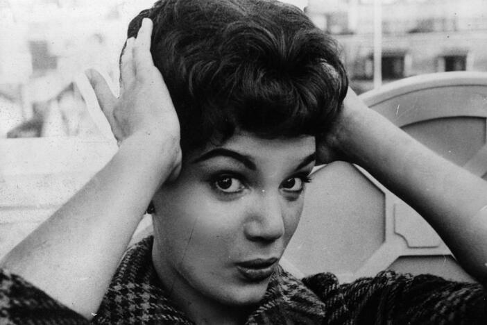 Connie Francis fixes her hair during a 1959 press reception at the Dorchester Hotel in London