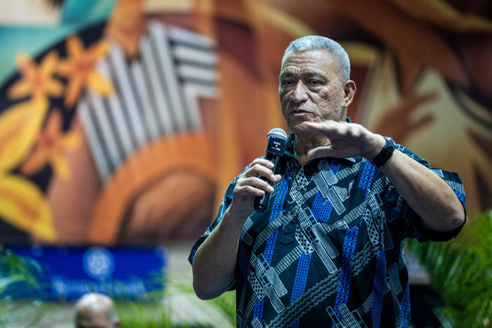 Maui Mayor Richard Bissen speaks at a community meeting at the Lahaina Civic Center. A complex cleanup is underway seven months after the wildfire, intended to protect historic buildings and artifacts.