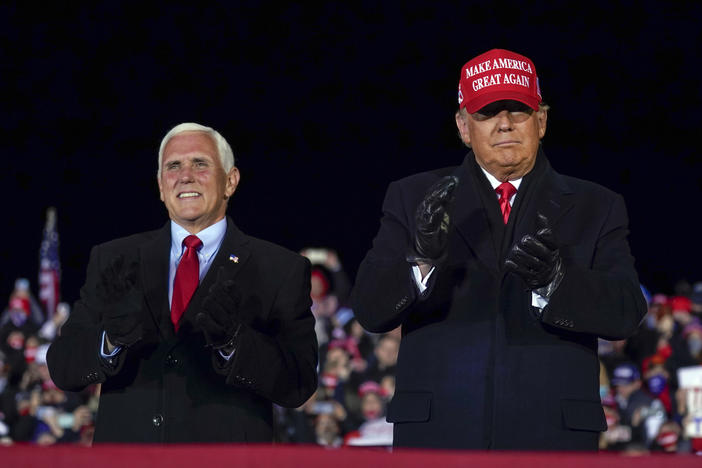 In this file photo, then-President Donald Trump arrives for a campaign rally at Gerald R. Ford International Airport, Nov. 2, 2020, in Grand Rapids, Mich., with then-Vice President Mike Pence. Despite running with him twice, in 2016 and in 2020, Pence will not endorse Trump in 2024.