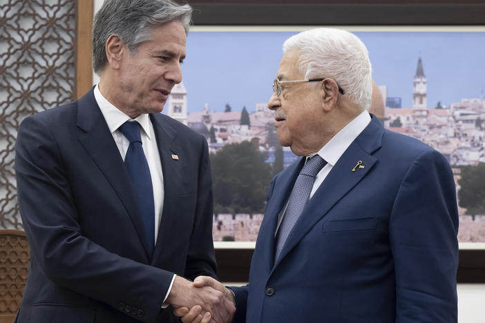 Palestinian Authority President Mahmoud Abbas (right) and U.S. Secretary of State Antony Blinken shake hands prior to a meeting at the presidential compound in the West Bank city of Ramallah on Nov. 30, 2023.