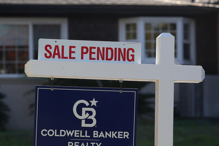 A "Sale Pending" sign is posted in front of a home for sale on Nov. 30, 2023, in San Anselmo, California. Real estate agents face lower commissions after a major settlement has upended the way Americans buy and sell homes.