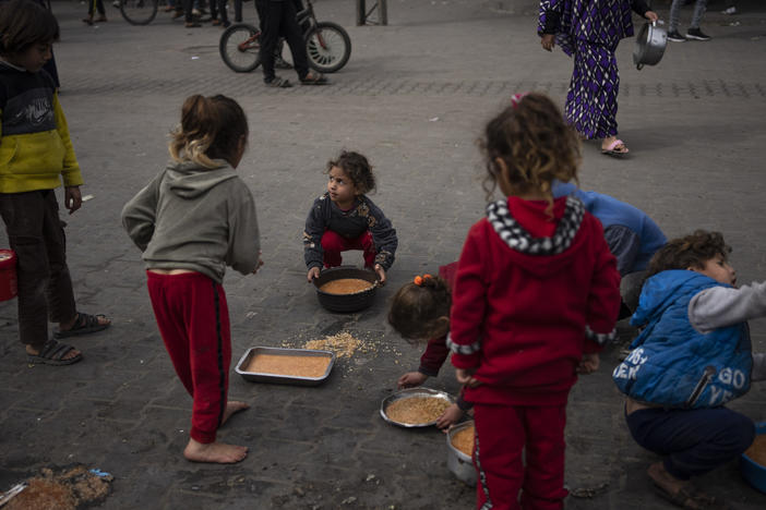 Palestinian children receive free food in Rafah, Gaza Strip, on Feb. 23. More than a million Palestinians displaced by the war have taken refuge in Rafah governorate, including an estimated 600,000 children.