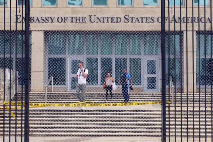 Workers at the U.S. Embassy in Havana leave the building in September 2017. New research out of the National Institutes of Health finds no unusual pattern of damage in the brains of Havana syndrome patients.
