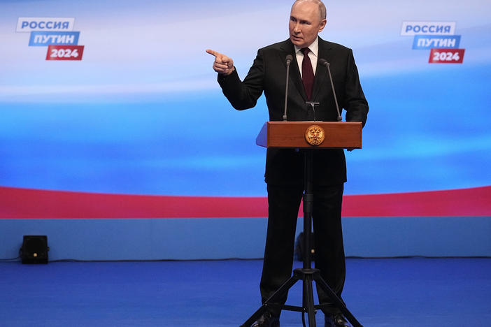 Russian President Vladimir Putin gestures while speaking on a visit to his campaign headquarters after a presidential election in Moscow.  What will another six years of Putin mean for Russia's war with Ukraine?