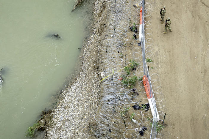 Texas National Guard soldiers are seen guarding the U.S.-Mexico border in Eagle Pass, Texas.