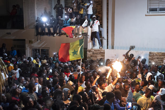 Supporters celebrate the release of Senegal's top opposition leader Ousmane Sonko and his key ally Bassirou Diomaye Faye outside Sonko's home in Dakar, Senegal, Thursday, March 14, 2024.