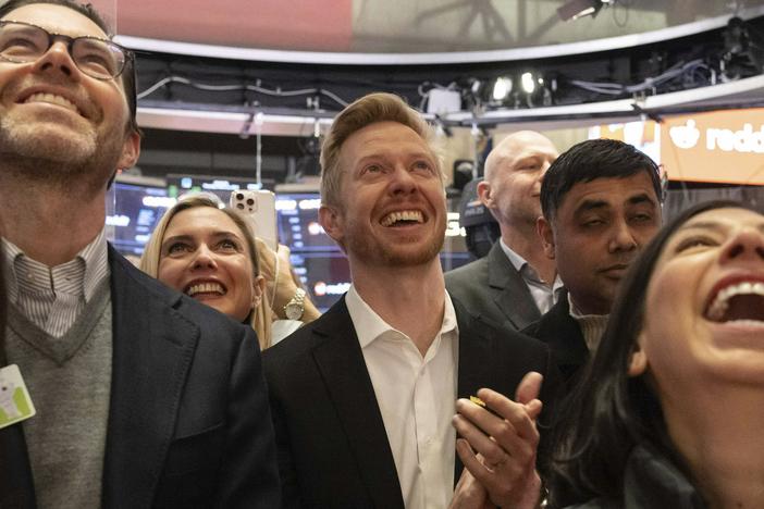 Reddit CEO Steve Huffman and company employees celebrate on the New York Stock Exchange trading floor, prior to his company's IPO, Thursday.
