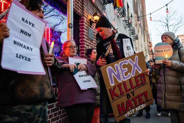 People gather outside the Stonewall Inn on Feb. 26 in New York City for a vigil for Nex Benedict, a 16-year-old who identified as nonbinary.
