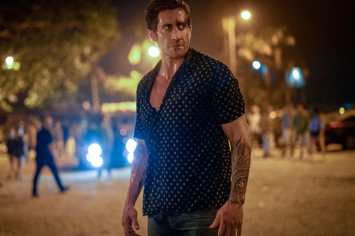 Jake Gyllenhaal is a former UFC star who becomes a bouncer in <em>Road House. </em>