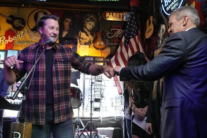 Country music star Luke Bryan gives a fist bump to Gov. Bill before Lee signed a bill Thursday, March 21, 2024, in Nashville, Tenn.
