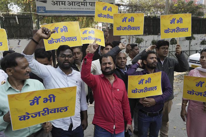 Supporters of the Aam Aadmi Party, or Common Man's Party, shout protest slogans outside the office of India's ruling Bharatiya Janata Party in New Delhi, India, on Friday. Anti-corruption crusader and AAP leader Arvind Kejriwal was arrested Thursday for suspected financial crimes.