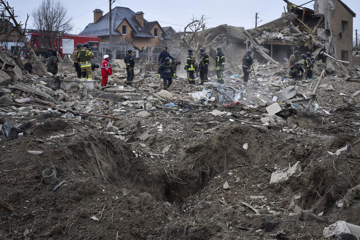 Ukrainian emergency workers clear the debris at the site of Russia's air attack, in Zaporizhzhia, Ukraine, Friday, March 22, 2024.