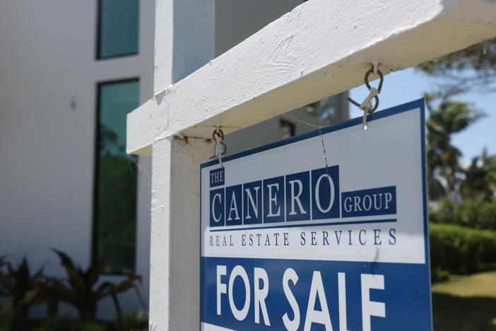 A 'For Sale' sign is posted on the lawn in front of a home on March 15, 2024, in Miami, Fla. The National Association of Realtors announced that it had reached a nationwide $418 settlement of claims that the industry had conspired to keep agent commissions high.
