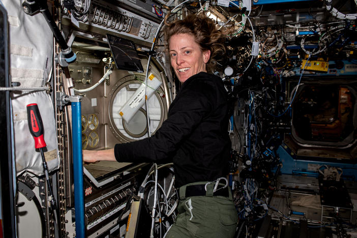 NASA astronaut and Expedition 70 Flight Engineer Loral O'Hara is pictured working with the Microgravity Science Glovebox, a contained environment crew members use to handle hazardous materials for various research investigations in space.