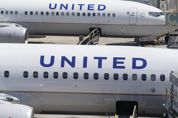 Two United Airlines Boeing 737s are parked at the gate at the Fort Lauderdale-Hollywood International Airport in Fort Lauderdale, Fla., on July 7, 2022.