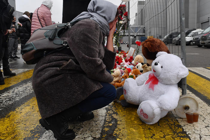 A woman mourns at a makeshift memorial in front of the Crocus City Hall on Saturday, a day after a gun attack in Krasnogorsk, outside Moscow, killed at least 133 people.