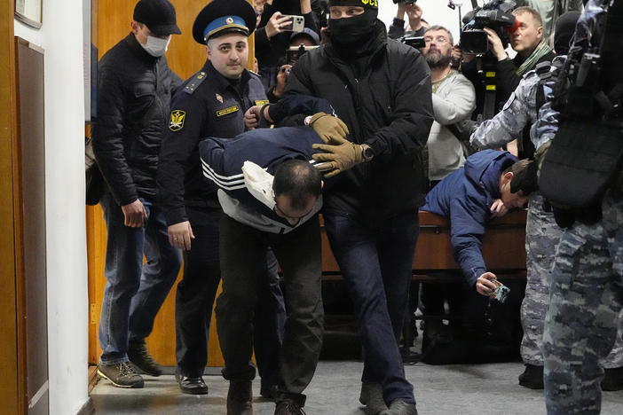 Saidakrami Murodali Rachabalizoda, a suspect in the Crocus City Hall shooting on Friday, is escorted by police and FSB officers in the Basmanny District Court in Moscow, Russia, Sunday, March 24, 2024.