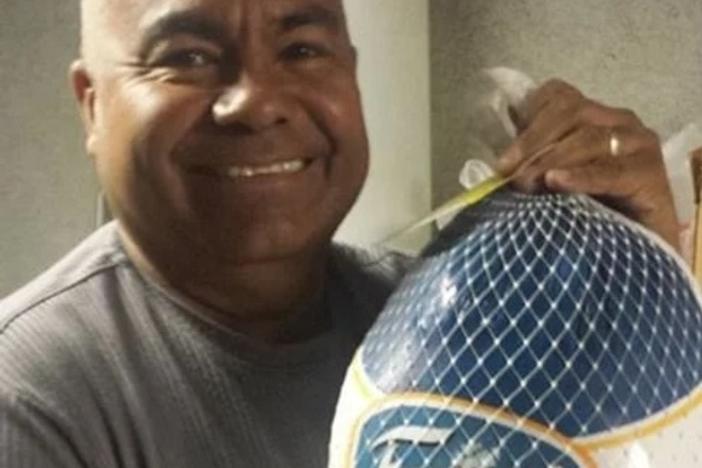 Jose Manuel Castro, the pastor of Gethsemani Baptist Church, holds a turkey. The church had a tradition of giving away turkeys every Thanksgiving except this past year due to troubles with the city, according to a suit.