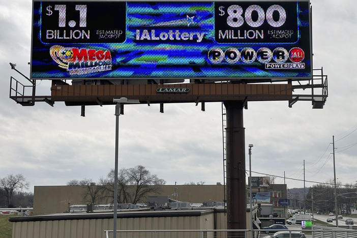 An electronic billboard advertises the Mega Millions and Powerball jackpots, Monday, March 25, 2024, in in Des Moines, Iowa.