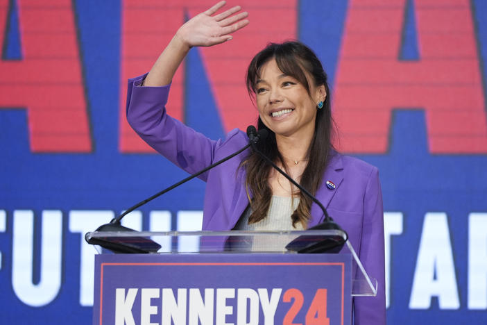Nicole Shanahan waves from the podium during a campaign event for independent presidential candidate Robert F. Kennedy Jr. Tuesday in Oakland, Calif. The California attorney is now RFK's running mate.
