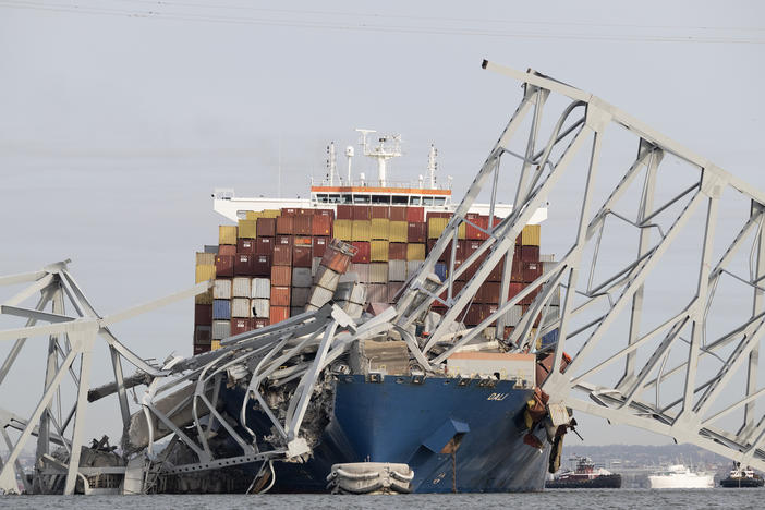 The steel frame of the Francis Scott Key Bridge sits on top of the container ship Dali after the bridge collapsed in Baltimore, Md., on Tuesday. <a href="https://www.gettyimages.com/license/2107843930?adppopup=true"></a>