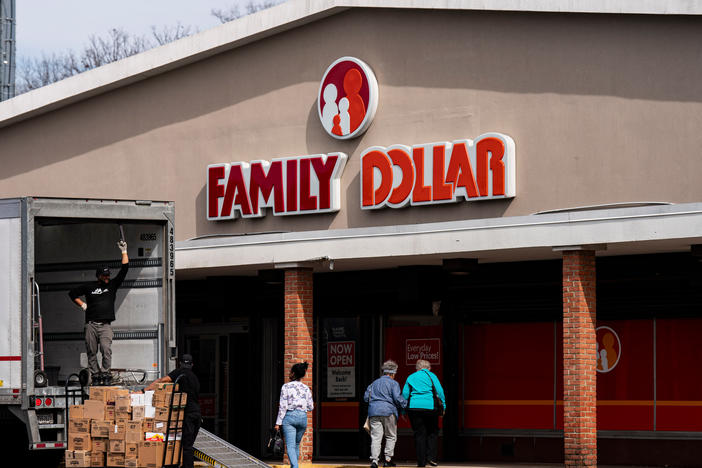Shoppers walk past a delivery truck outside a Family Dollar in Hyattsville, Maryland. Family Dollar has announced it's closing 600 stores this year.