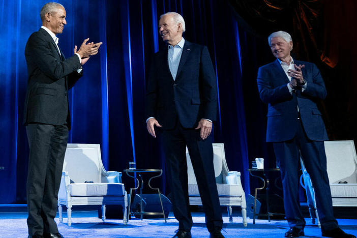 Former Presidents Barack Obama and Bill Clinton clap for President Biden during a campaign fundraising event at Radio City Music Hall in New York City on Thursday.