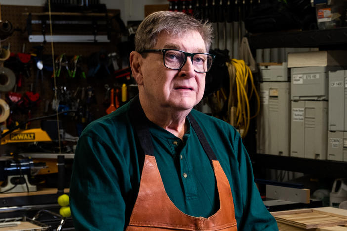 Tom Noffsinger stands in his garage workshop, where he uses a SawStop table saw for woodworking at his home in Raleigh, North Carolina. About 20 years ago, Noffsinger had a table saw accident and almost lost his thumb.