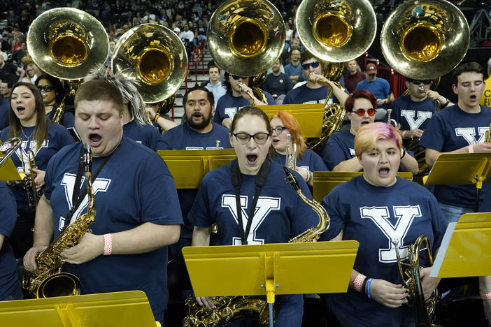 The University of Idaho Marching Band, wearing Yale T-shirts, performs at the NCAA Tournament game between Yale and San Diego State in Spokane, Wash., on Sunday. The band has been honored in Connecticut for filling in as Bulldogs.