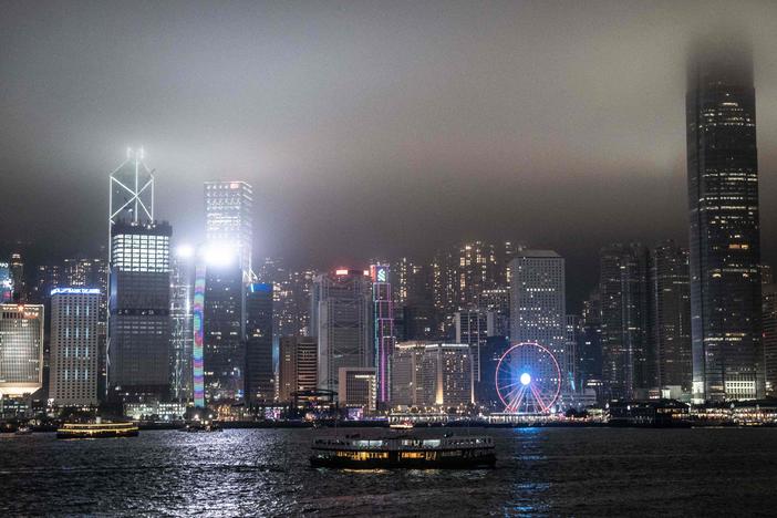 A view of the Hong Kong skyline is pictured before the lights were turned off to mark the Earth Hour environmental campaign on March 25, 2023.