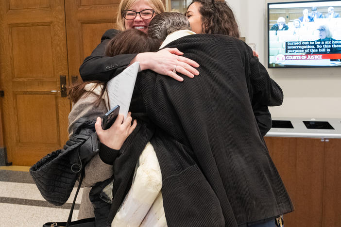 Lisa Sales, President of the Virginia National Organization for Women, embraces her colleagues Federico Cura, of Arlington, Mariam Torosyan, who flew in from Armenia to testify, and Tamar Dekanosidze, of Bethesda, after giving testimony on HB 994 in front of the Senate committee on Courts of Justice on Wednesday, February 28, 2024 at General Assembly Building in Richmond, Virginia.