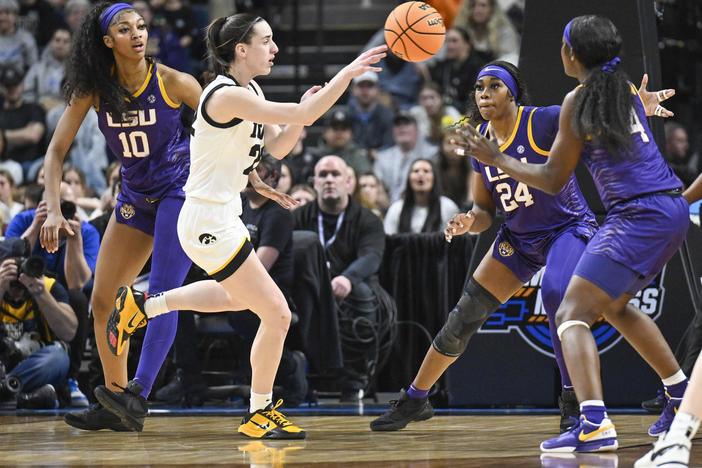 LSU's Angel Reese, left, and Iowa guard Caitlin Clark, center, called their Elite Eight game a great event for their sport. Millions of viewers agreed, launching the contest to the top of ESPN's ratings.