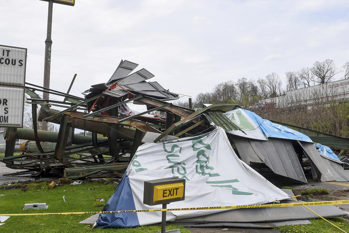 A steel billboard and its support were blown over in Dunbar, W.Va., Tuesday, April 2, 2024, after severe storms blew through the area.