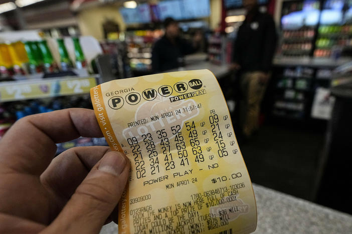 A Powerball lottery ticket is displayed seen inside a convenience store, Monday, April 1, 2024, in Kennesaw, Ga.