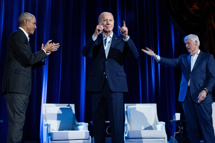Former President Barack Obama (left) and former President Bill Clinton (right) cheer for President Biden during a campaign fundraising event at Radio City Music Hall in New York City on March 28.