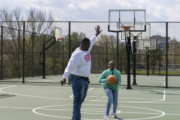 Joseph Yusuf plays basketball with his daughter, Jakayla Morton, 11, in Alexandria, Va., on March 29.